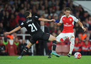 Arsenal vs. Liverpool Showdown: Ozil vs. Leiva Clash in the 2015/16 Premier League