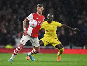 Arsenal vs. Liverpool: White Holds Off Mane in Intense Premier League Clash