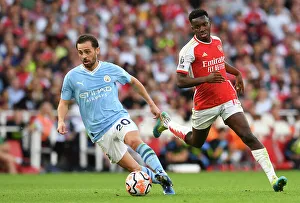 Arsenal vs Manchester City: Bernardo Silva vs Eddie Nketiah - Intense Battle at Emirates Stadium (2023-24 Premier League)