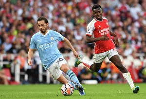 Images Dated 9th October 2023: Arsenal vs Manchester City: Bernardo Silva vs Eddie Nketiah - Intense Battle at Emirates Stadium