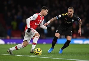 Images Dated 16th December 2019: Arsenal vs Manchester City: Gabriel Martinelli Under Pressure
