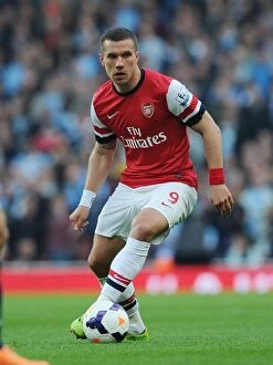 Images Dated 29th March 2014: Arsenal vs Manchester City: Lukas Podolski in Action at the Emirates Stadium, Premier League 2013/14
