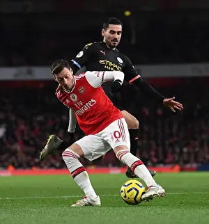 Arsenal V Manchester City 2019-20 Prints: Arsenal vs Manchester City: Ozil Under Pressure in Intense Premier League Clash