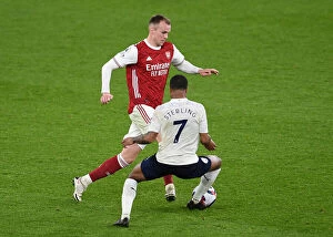 Images Dated 21st February 2021: Arsenal vs Manchester City: Rob Holding vs Raheem Sterling in Empty Emirates Stadium - Premier