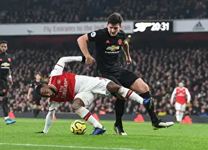 Arsenal vs Manchester United: Lacazette vs Maguire - Premier League Showdown (2019-20): A Battle of Stars at Emirates Stadium