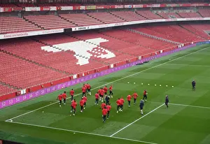 Arsenal vs Manchester United: Premier League Showdown - Arsenal Squad Warm-Up at Emirates Stadium
