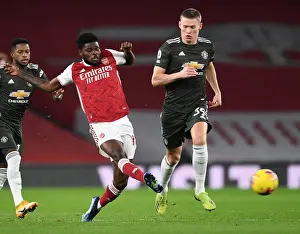 Arsenal V Manchester United 2020-21 Prints: Arsenal vs Manchester United: Thomas Partey Faces Off Against Scott McTominay in Empty Emirates Stadium