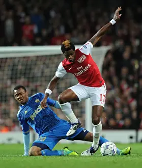 Arsenal V Marseille 2011-12 Prints: Arsenal vs Marseille: Clash between Alex Song and Jordan Ayew in the 2011-12 UEFA Champions League