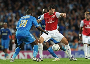 Arsenal V Marseille 2011-12 Prints: Arsenal vs. Marseille: Robin van Persie Clashes with Souleymane Diawara in the 2011-12 UEFA Champions League