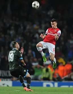 Arsenal V Napoli 2013-14 Prints: Arsenal vs. Napoli: Koscielny's Heading Battle in the 2013-14 Champions League