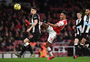 Arsenal v Newcastle United 2019-20 Collection: Arsenal vs Newcastle: Aubameyang Faces Off Against Fernandez in Premier League Clash