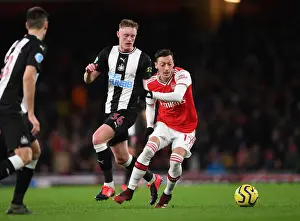 Arsenal V Newcastle United 2019-20 Prints: Arsenal vs Newcastle: Ozil Clashes with Longstaff in Premier League Showdown