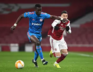 Arsenal vs. Olympiacos: Martinelli Fouls Ousseynou Ba in Empty Europa League Clash