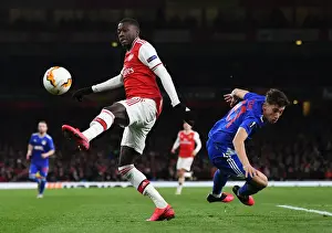 Arsenal V Olympiacos 2019-20 Prints: Arsenal vs Olympiacos: Pepe Faces Off Against Tsimikas in Europa League Clash