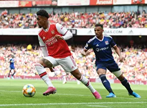 Arsenal V Olympic Lyonnais 2019-20 Prints: Arsenal vs. Olympique Lyonnais Clash: Reiss Nelson Faces Fernando Marcal at the Emirates Cup