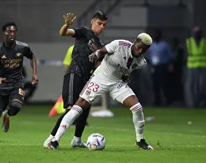 Arsenal V Olympique Lyonnais 2022-23 Prints: Arsenal vs. Olympique Lyonnais: A Fierce Battle in the Dubai Super Cup