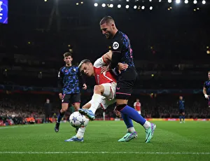 Arsenal V Sevilla 2023-24 Prints: Arsenal vs. Sevilla Showdown: Trossard vs. Gudelj - Champions League Clash (2023-24)