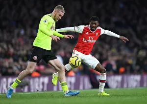 Images Dated 18th January 2020: Arsenal vs Sheffield United: Ainsley Maitland-Niles Closes Down Oli McBurnie in Intense Premier