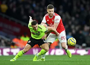 Images Dated 18th January 2020: Arsenal vs Sheffield United: Mustafi Clashes with Sharp in Premier League Showdown