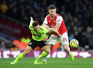 Arsenal vs Sheffield United: Mustafi Clashes with Sharp in Premier League Showdown