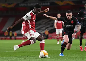Arsenal V Slavia Prague 2020-21 Prints: Arsenal vs Slavia Prague: Bukayo Saka Tackled in UEFA Europa League Quarterfinal at Empty Emirates Stadium