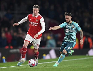 Images Dated 21st April 2023: Arsenal vs. Southampton: Rob Holding Clashes with Adam Armstrong in Premier League Showdown