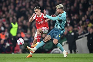 Images Dated 21st April 2023: Arsenal vs. Southampton: Trossard Fights for Possession in Intense Premier League Clash