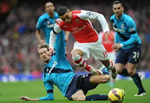 Arsenal V Stoke City 2014-15 Prints: Arsenal vs Stoke City: Oxlade-Chamberlain Tackles Crouch in Intense Premier League Clash
