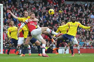 Arsenal V Sunderland 2013-14 Prints: Arsenal vs Sunderland: Per Mertesacker Faces Off Against John O'Shea and Jozy Altidore