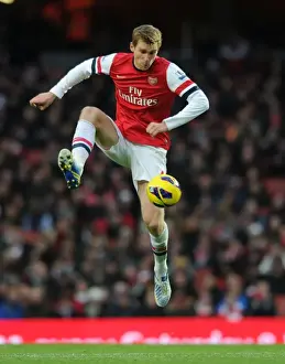 Swansea Prints: Arsenal vs Swansea City: Per Mertesacker in Action at Emirates Stadium (Premier League 2012-13)