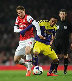 Arsenal V Swansea City 2013-14 Prints: Arsenal vs Swansea: Intense Battle between Kim Kallstrom and Jonathan De Guzman