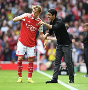 Arsenal vs. Tottenham: Mikel Arteta and Martin Odegaard in Deep Conversation during the 2022-23 Premier League Clash at Emirates Stadium