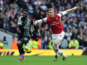 Arsenal V Tottenham Hotspur 2012-13 Prints: Arsenal vs. Tottenham: Intense Rivalry - Per Mertesacker vs. Emmanuel Adebayor
