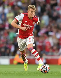 Arsenal vs. Tottenham: Martin Odegaard in Action at the Emirates Stadium, Premier League 2021-22