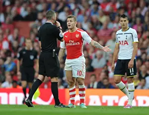 Arsenal V Tottenham Hotspur 2014-15 Prints: Arsenal vs. Tottenham: Wilshere and the Ref during the Intense 2014-15 Premier League Clash