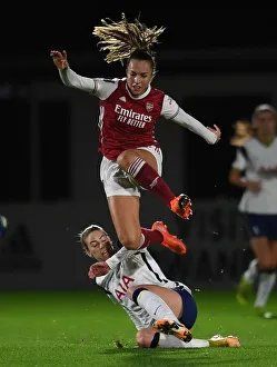 Arsenal Women V Tottenham Hotspur Women - Conti Cup 2020-21 Prints: Arsenal vs. Tottenham Women's FA Cup Clash: Lia Walti Leaps Over Alanna Kennedy Amid Empty Stands
