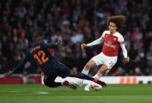 Images Dated 2nd May 2019: Arsenal vs Valencia: Clash between Guendouzi and Diakhaby in UEFA Europa League Semi-Final