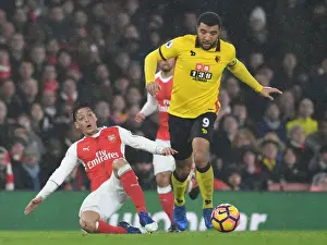 Arsenal V Watford 2016-17 Prints: Arsenal vs. Watford: Clash Between Ozil and Deeney in the Premier League