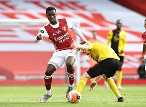 Images Dated 26th July 2020: Arsenal vs. Watford: Eddie Nketiah Clashes with Will Hughes in Premier League Showdown