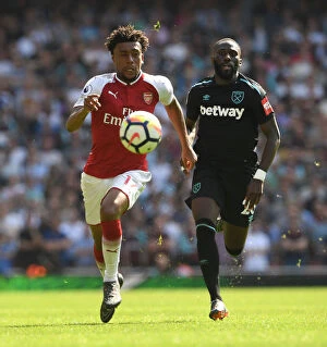 Arsenal v West Ham United 2017-18 Collection: Arsenal vs. West Ham: Iwobi vs. Masuaku in Intense Battle at Emirates Stadium
