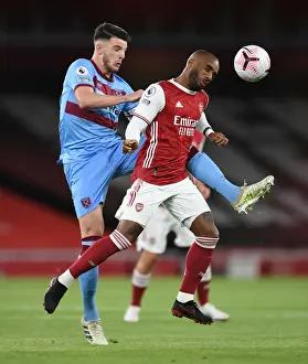 Arsenal V West Ham United 2020-21 Prints: Arsenal vs. West Ham: Lacazette Heads Away from Rice in 2020-21 Premier League Clash