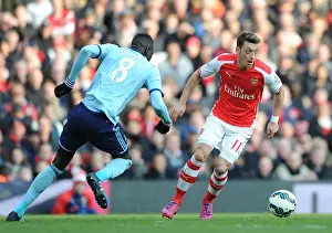 Arsenal V West Ham United 2014/15 Prints: Arsenal vs. West Ham United: Mesut Ozil Faces Off Against Cheikhou Kouyate in Premier League Clash