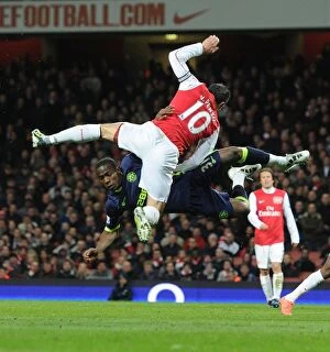 Images Dated 16th April 2012: Arsenal vs. Wigan: Van Persie vs. Figueroa in Intense Battle