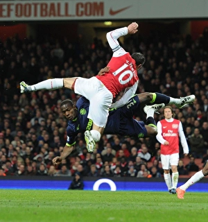 Arsenal vs. Wigan: Van Persie vs. Figueroa in Intense Battle
