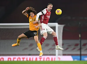 Arsenal vs. Wolverhampton Wanderers: Rob Holding's Heading Duel in Empty Emirates Stadium (Premier League 2020-21)