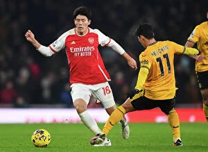 Arsenal v Wolverhampton Wanderers 2023-24 Collection: Arsenal vs. Wolverhampton Wanderers: Tomiyasu vs. Hwang Hee-Chan - A Premier League Battle at