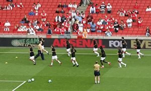 Images Dated 3rd September 2007: Arsenal warm up in front of the Arsenal For Everyone boards
