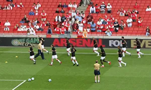 Arsenal V Portsmouth 2007-08 Prints: Arsenal warm up in front of the Arsenal For Everyone boards