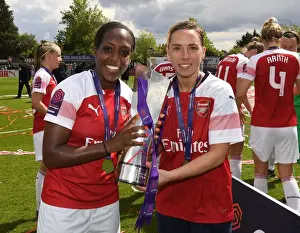 Arsenal Women Celebrate WSL Title: Danielle Carter and Jordan Nobbs Hold the Trophy