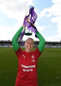 Images Dated 11th May 2019: Arsenal Women Celebrate WSL Title with Sari van Veenendaal and the Trophy